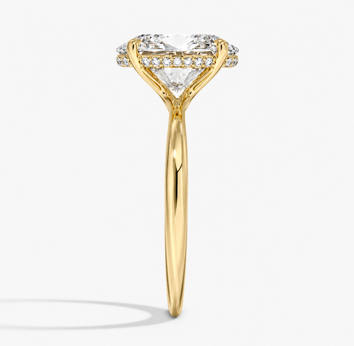 Hidden halo engagement ring in 14K/18K yellow gold, close-up detail