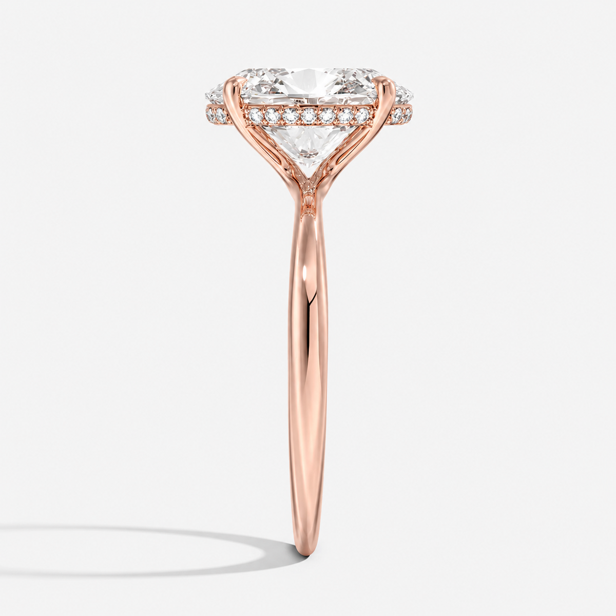 Hidden halo engagement ring in 14K rose gold, close-up detail